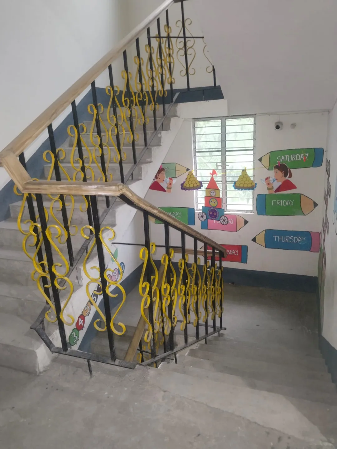 Colourful artwork beside the stairs