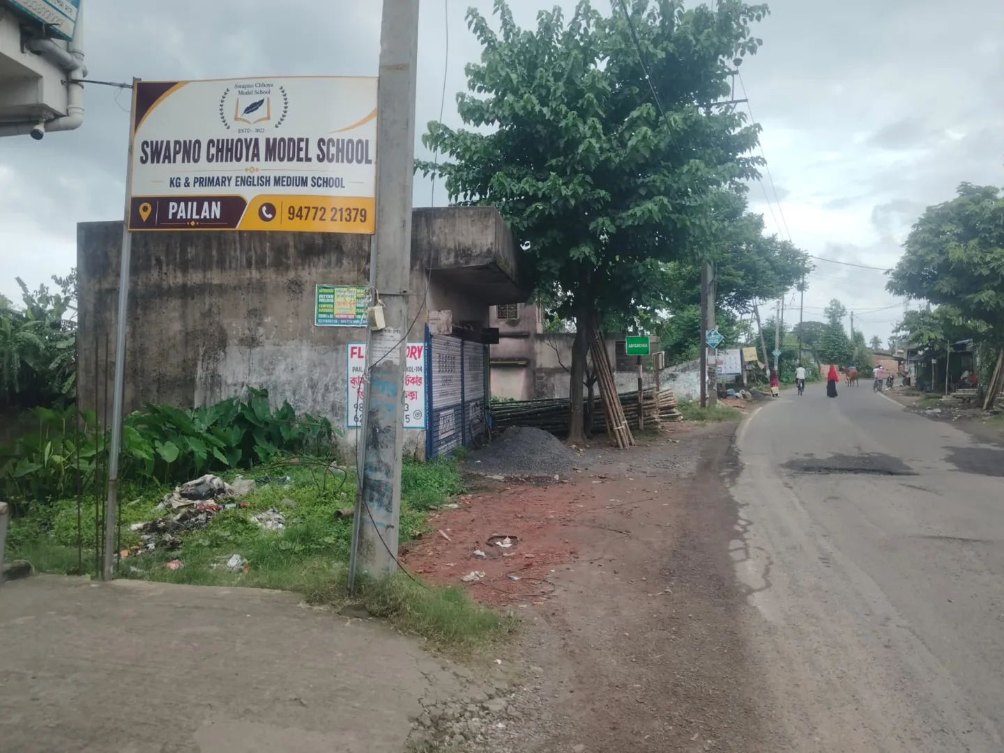 The school sign and approach road